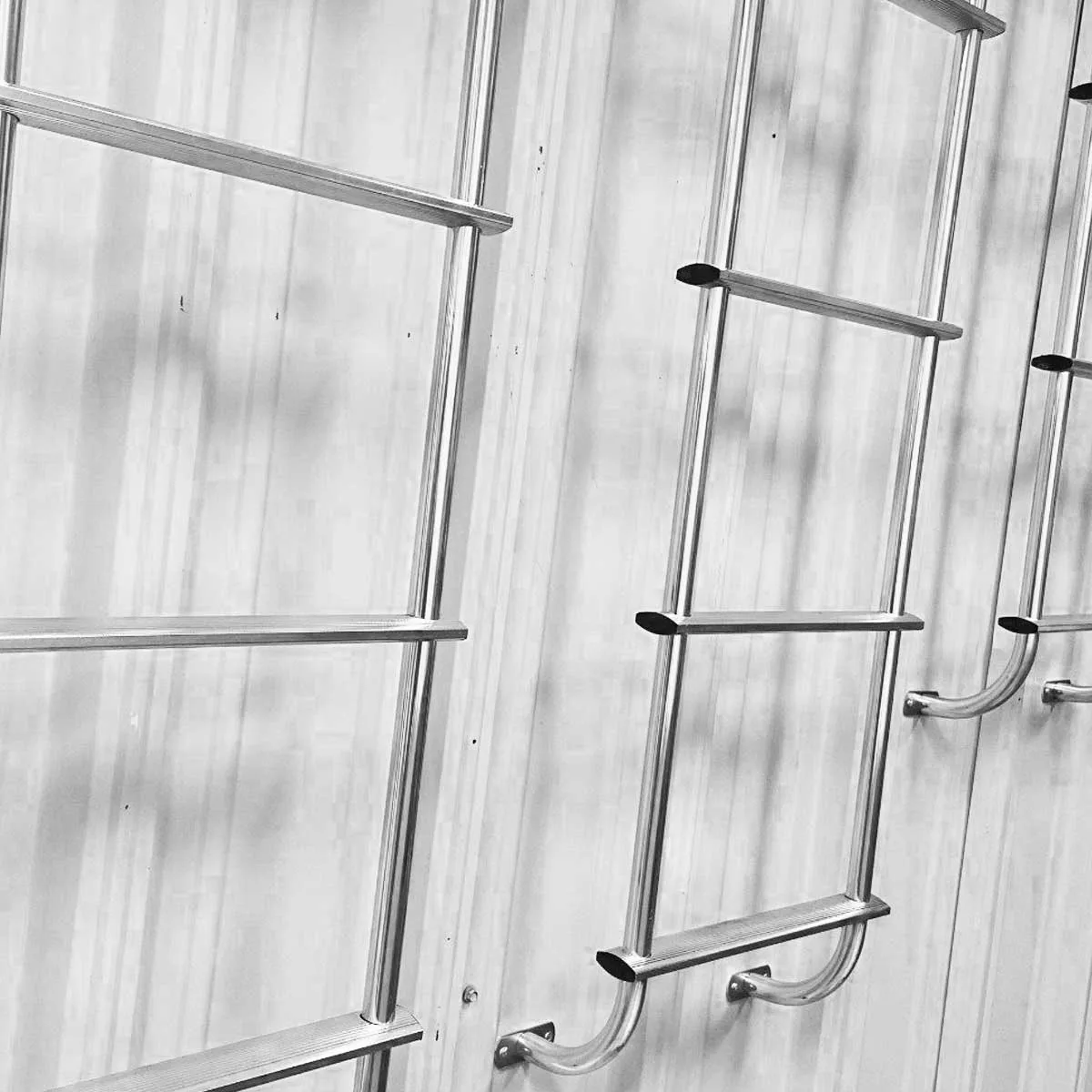 Egress window well escape ladders